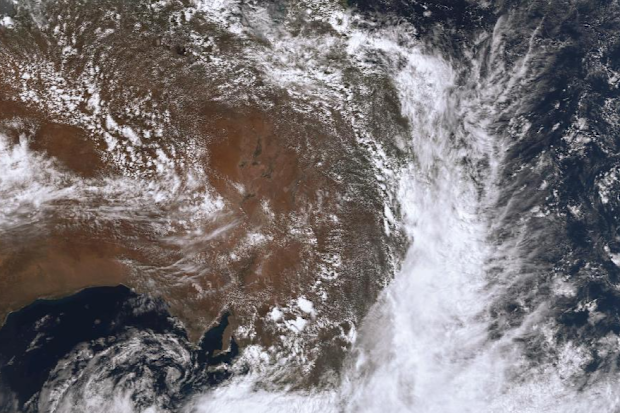 A band of cloud is covering the entire east coast of Australia bringing rain and warnings of flooding.