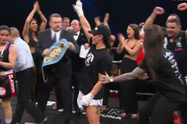 Cherneka Johnson celebrates winning the IBF super bantamweight title.