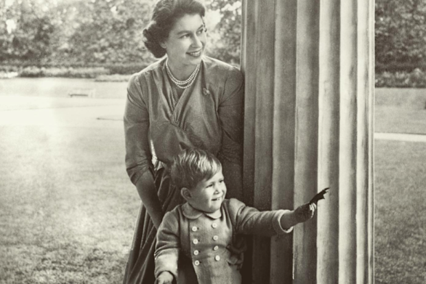 A young Prince Charles plays in the Clarence House garden with his mother, Princess Elizabeth, in 1950. 