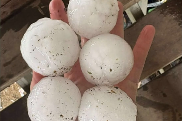 A massive supercell thunderstorm has hammered parts of Queensland, unleashing giant hail, fierce winds and lightning