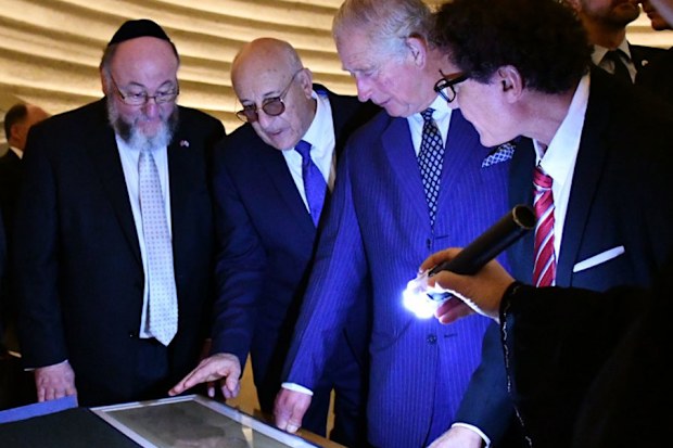 The Prince of Wales hears about the Shrine of the Book exhibition which houses the Dead Sea Scrolls, the world's oldest biblical manuscripts. HRH had the opportunity to view the scrolls inside the Shrine of the Book.
