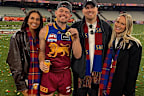 Tess Crosley has since deleted the photos showing her celebrating Brisbane's AFL grand final victory alongside her husband and Lachie and Jules Neale.