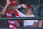Sydney Sweeney and her dad waved to the cameras as they were spotted at the Sydney Swans vs Melbourne match on May 3. 