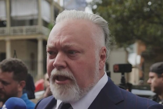 Kyle Sandilands was mobbed by reporters outside of court.