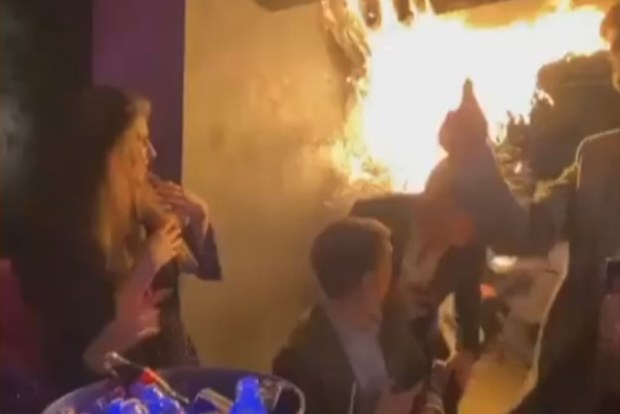 Diners fled after a Christmas tree caught fire at a lavish London restaurant.Flames can be seen in footage taken at MNKY HSE in the upmarket Mayfair area.
