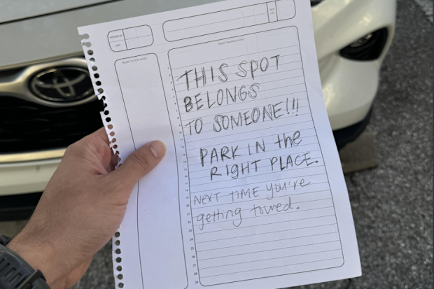 angry note left on car at parent's apartment building