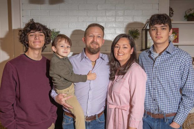 Gavin Guffey alongside his two brothers and his mum and dad. 
