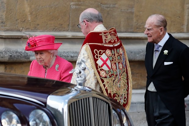 Britain's Queen Elizabeth II, left, and Prince Philip leave the chapel after the wedding of Lady Gabriella Windsor and Thomas Kingston at St George's Chapel, Windsor Castle.