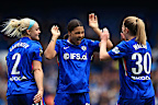 Sam Kerr of Chelsea celebrates scoring her team's first goal with teammates Ellie Carpenter and Keira Walsh.