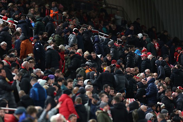 Liverpool fans leave their seats early.