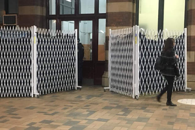 Strip search screens at Sydney's Central Station. 