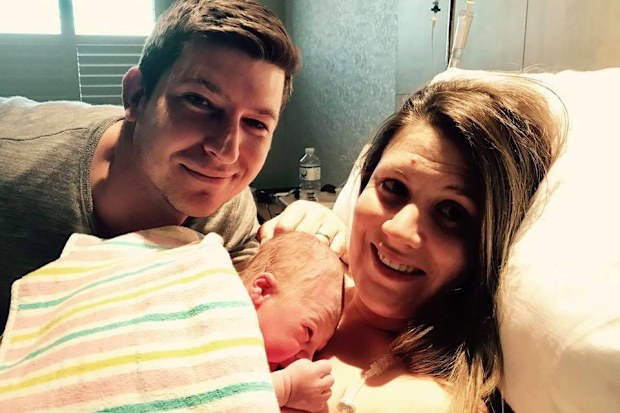 Craig Anderson with wife Bec and his newborn son. 