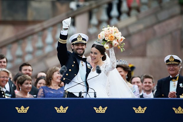 At the Royal Palace appearing in front of the gathered crowd.