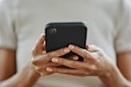 Home woman hands, social media and phone contact, communication and smartphone technology in living room. Closeup mobile app multimedia, reading internet fake news online and 5g web social networking