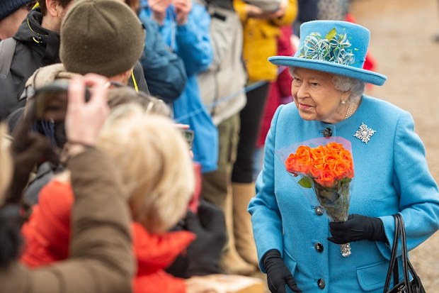 The Queen all smiles at church at St Peter and St Paul church