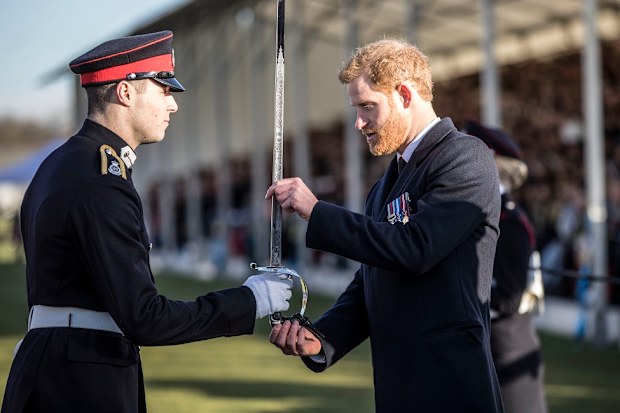 Britain's Prince Harry presents the sword of honour to the best overall officer cadet at The Royal Military Academy Sandhurst.