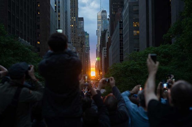 New Yorkers line the streets to capture Manhattanhenge. May 29, 2018