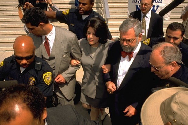 Monica Lewinsky goes to give FBI fingerprints hand writing samples. 