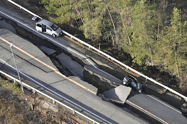 A damaged road is seen following an earthquake in Anamizumachi, Ishikawa prefecture, Japan on Tuesday.