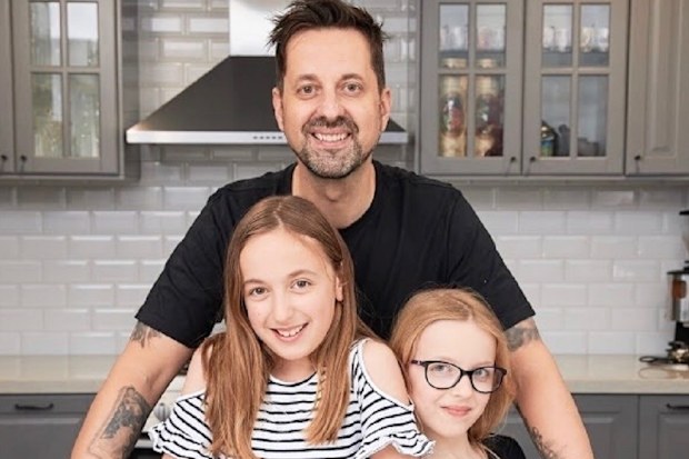 George 'Lunchbox Dad' with his daughters.