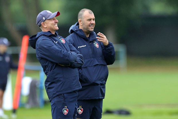 Michael Cheika talks to Peter Hewat at Oadby Oval in Leicester.