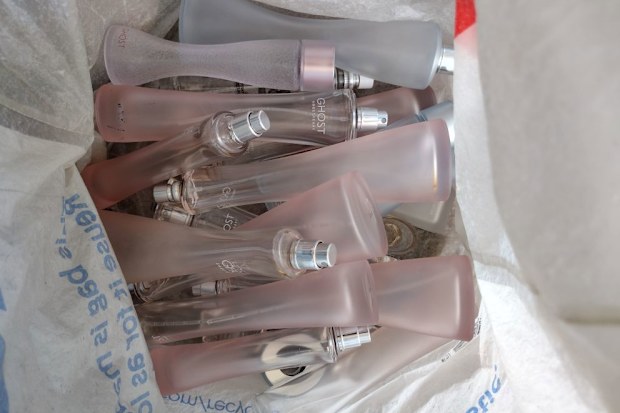 Bag filled with empty perfume bottles