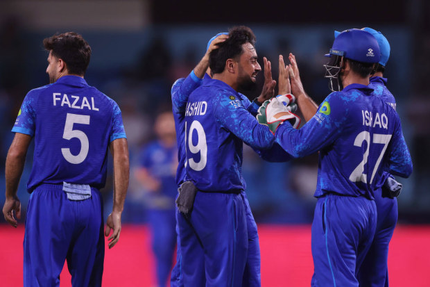 Rashid Khan celebrates with teammates after dismissing Soumya Sarkar of Bangladesh (not pictured).