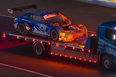 The battered Ford Mustang is towed back to the pits after Christopher Mies' high-speed encounter with a kangaroo.