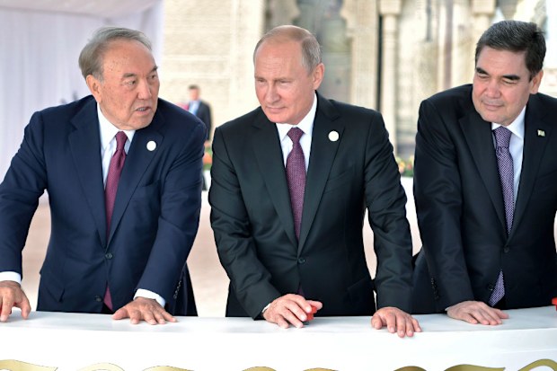 Russian President Vladimir Putin, centre, Kazakhstan President Nursultan Nazarbayev, left, and Turkmenistan President Gurbanguly Berdimuhamedow talk during the Caspian summit.