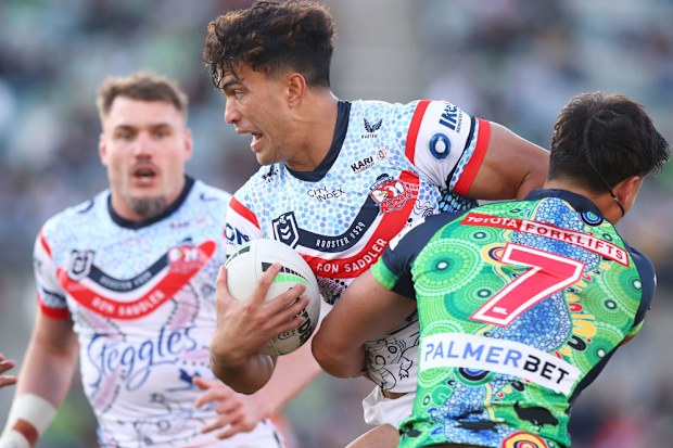 Joseph-Aukuso Su'ali'i is tackled by  Raiders' halfback Kaeo Weekes.