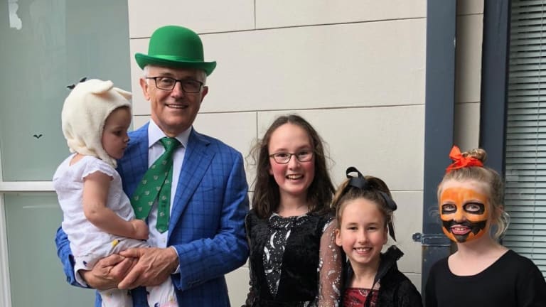 Former prime minister Malcolm Turnbull with Astrid Gardan, Saskia Gardan and Sofia White, trick or treating for Halloween. 