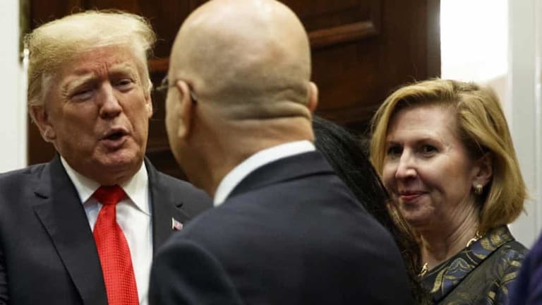 US Deputy National Security Adviser Mira Ricardel watches as Donald Trump arrives for a Diwali ceremonial lighting of the Diya in the White House on Tuesday. 