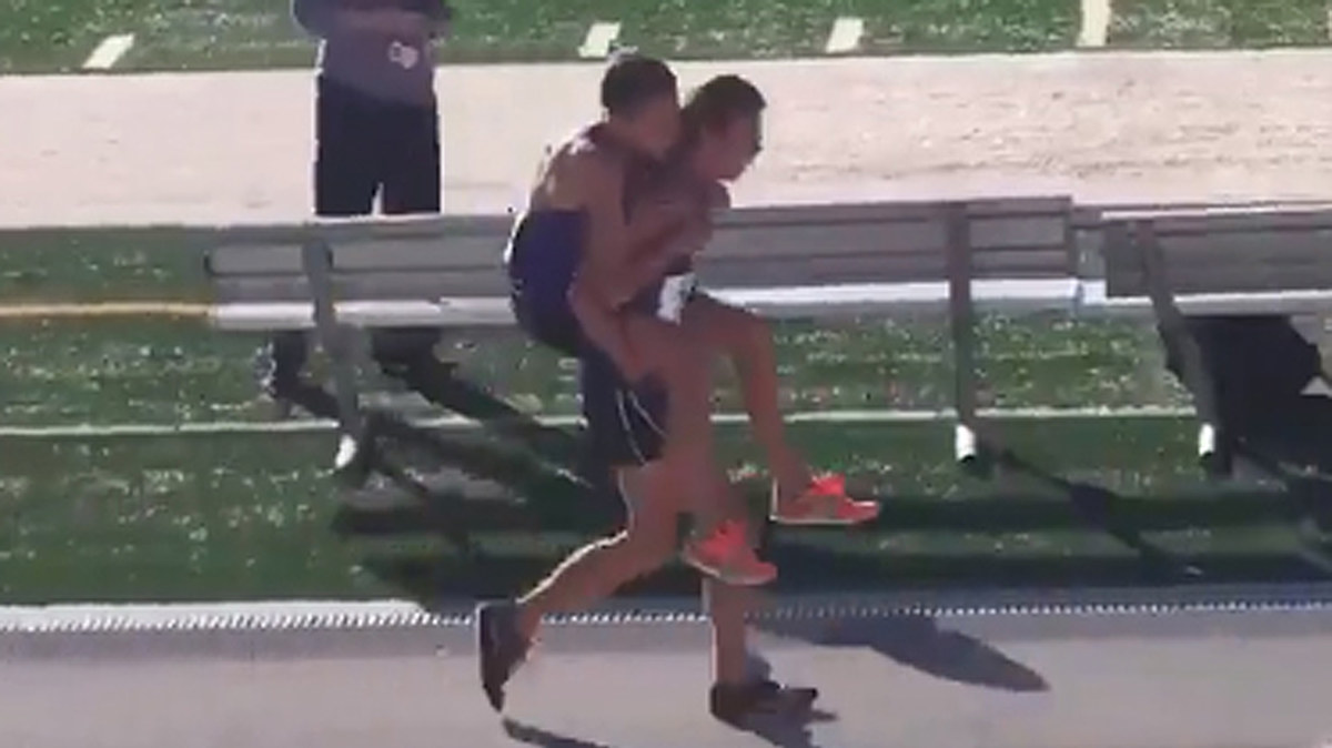 High school athlete carries injured teammate over the finish line ...