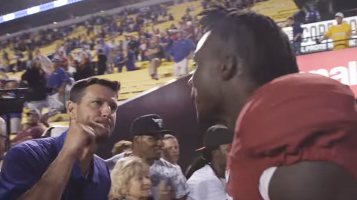 Aggressive fan confronts college player | Nine.com.au