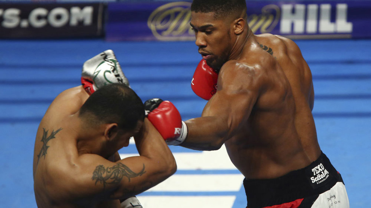 Boxing: Joshua retains world heavyweight title, targets Klitschko ...