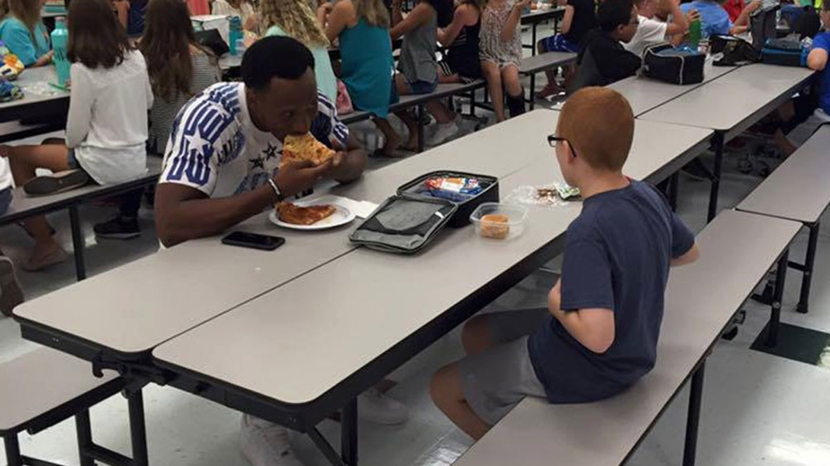 Autistic boy now popular after lunch with college football star