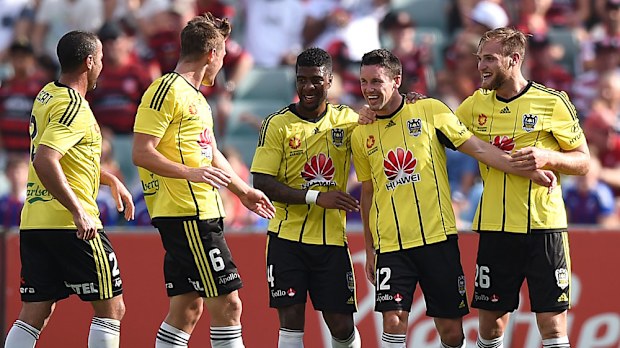 Phoenix players celebrate a goal against the Wanderers. (AAP)