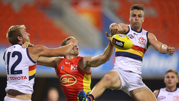 Brodie Smith of the Crows punches the ball. (Getty) 