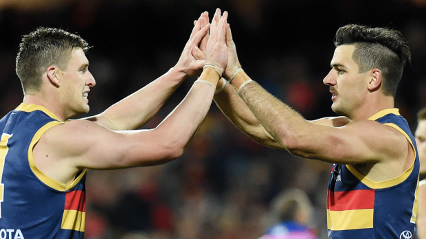 Taylor Walker (right) will captain the Crows in 20917. (AAP)