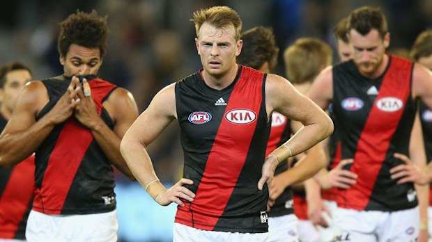Brendon Goddard (centre) with Bombers teammates. (Getty)