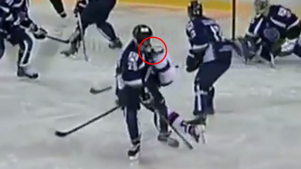 Russian ice hockey player Vital Sitnikov cops a rival's skate to the throat. (Supplied)