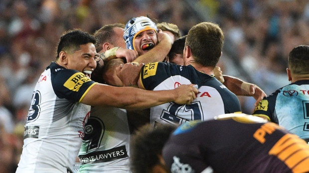 Johnathan Thurston and Cowboys teammates celebrate their grand final win. (AAP)