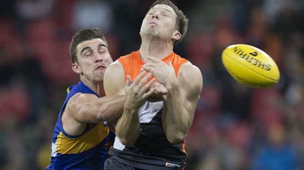 Wests Coast's Elliott Yeo and GWS star Toby Greene battle for possession. (AAP)