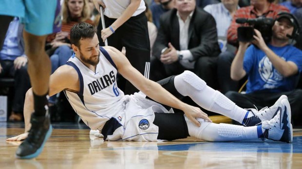 Andrew Bogut goes down with injury. (AAP-file)