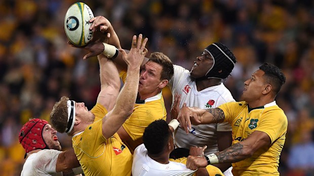 Wallabies and England players contest a line-out,. (AAP)