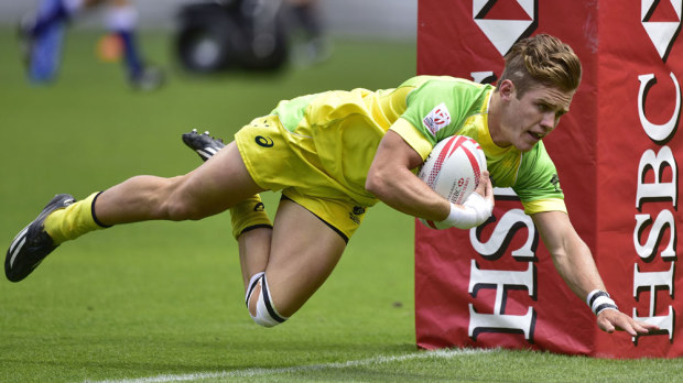 Tom Lucas scores a try for Australia. (AFP)