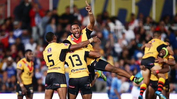 Papua New Guinea players celebrate after beating Fiji. (Getty)