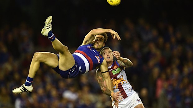 Tory Dickson flies for a mark. (AAP)