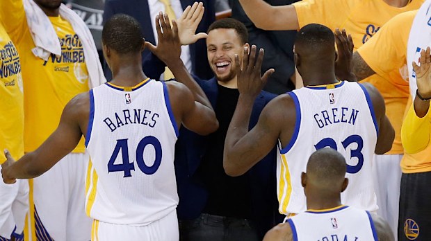 Steph Curry high fives Warriors teammates after their playoffs win over Portland. (Getty) 
