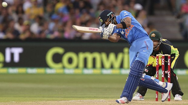 Virat Kohli smashes a ball on his way to an unbeaten 90.